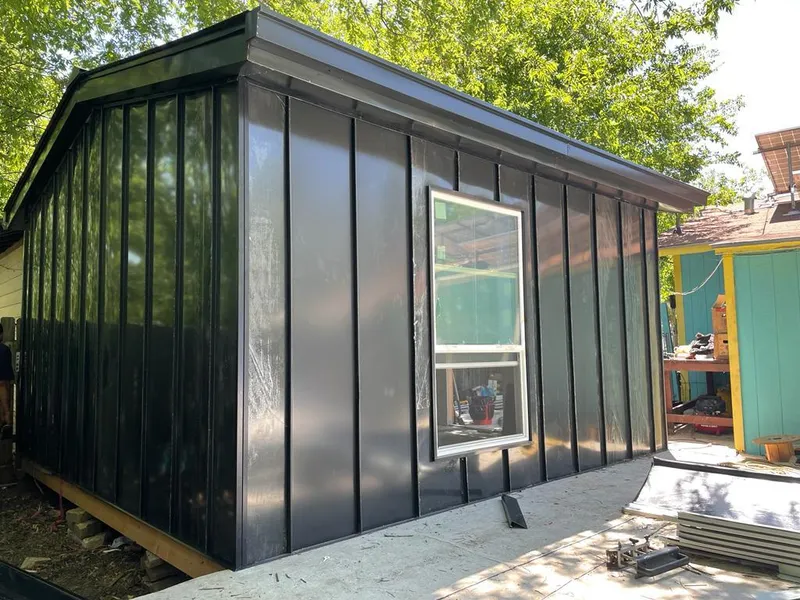 Black standing seam metal wall panels for Roof Inspection in Polson